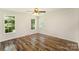Sunlit bedroom with wood floors and large windows at 508 Bridgestone Ln, Rock Hill, SC 29730