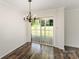 Dining area with chandelier and sliding glass doors to outside patio deck at 508 Bridgestone Ln, Rock Hill, SC 29730
