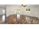 Spacious living area featuring elegant lighting, a sliding glass door, and beautiful laminate flooring, perfect for entertaining at 508 Bridgestone Ln, Rock Hill, SC 29730