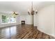 Spacious living area with a decorative chandelier, fireplace, and stylish laminate flooring, ideal for relaxing and entertaining at 508 Bridgestone Ln, Rock Hill, SC 29730