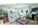 Open concept living space with fireplace and stylish furniture at 513 Jacobus Ln, Monroe, NC 28112