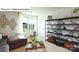 Bright living room features modern decor, large window, and stylish shelving units at 513 Jacobus Ln, Monroe, NC 28112