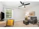 Comfortable bedroom featuring a sofa, desk, and a large window for natural light at 551 Sand Trap Dr, York, SC 29745