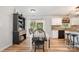 Dining area featuring white table and chairs, adjacent to a modern kitchen at 551 Sand Trap Dr, York, SC 29745