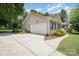 Charming home exterior featuring a two-car garage and beautifully landscaped front yard at 551 Sand Trap Dr, York, SC 29745
