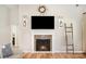 Close-up of a stylish fireplace with mantle and decorative tile work at 551 Sand Trap Dr, York, SC 29745