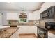 Modern kitchen boasts stainless appliances, granite countertops and mosaic backsplash at 551 Sand Trap Dr, York, SC 29745