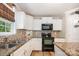 Well lit kitchen features stainless steel appliances and granite countertops at 551 Sand Trap Dr, York, SC 29745