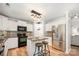 Modern kitchen with stainless steel appliances, granite countertops, and island seating at 551 Sand Trap Dr, York, SC 29745