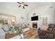 Open concept living area with fireplace, hardwood floors, and comfortable seating at 551 Sand Trap Dr, York, SC 29745