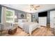 Comfortable primary bedroom features wood-look floors and ample closet space at 551 Sand Trap Dr, York, SC 29745