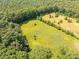 Aerial perspective showing extensive land surrounded by trees, offering vastness and natural beauty at 6115 Campbell Rd, York, SC 29745