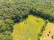 Sprawling landscape featuring open fields, dense forests, and tranquil surroundings from a bird's eye view at 6115 Campbell Rd, York, SC 29745