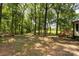 Secluded, wooded backyard, perfect for nature lovers, featuring mature trees and natural beauty at 6115 Campbell Rd, York, SC 29745