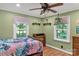 Bedroom featuring green walls, wood-look flooring, and two large windows at 6115 Campbell Rd, York, SC 29745