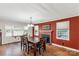 Cozy dining room with brick fireplace, wood flooring, and a large table with seating for six at 6115 Campbell Rd, York, SC 29745