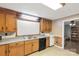 Traditional kitchen featuring wood cabinetry, laminate countertops, and a black appliance suite at 6115 Campbell Rd, York, SC 29745