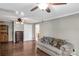 Comfortable living room with hardwood floors, a ceiling fan, and a cozy couch at 6115 Campbell Rd, York, SC 29745
