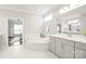 Bright bathroom features a soaking tub with elegant tile surround, and access to the bedroom at 6320 Tilley Way, Matthews, NC 28105