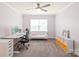 Bright bedroom featuring a cozy sofa, desk, and storage, perfect for work or relaxation at 6320 Tilley Way, Matthews, NC 28105