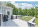 Open deck overlooking a wooded backyard with a grill at 6320 Tilley Way, Matthews, NC 28105