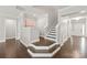 Inviting foyer with hardwood floors, elegant staircase, and an open floor plan at 6320 Tilley Way, Matthews, NC 28105
