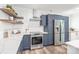 Kitchen boasting modern stainless steel appliances, blue cabinets, and a white countertop at 6320 Tilley Way, Matthews, NC 28105