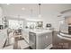 Bright, open kitchen featuring a large island, stainless steel appliances, and seamless flow into the living area at 6320 Tilley Way, Matthews, NC 28105