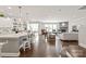 Spacious open-concept kitchen with a large island, barstool seating and seamless flow to the living room at 6320 Tilley Way, Matthews, NC 28105