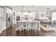 Modern kitchen with white cabinets, stainless steel appliances, and a large center island with seating at 6320 Tilley Way, Matthews, NC 28105