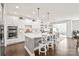 Modern kitchen with white cabinets, stainless steel appliances, and a large center island with seating at 6320 Tilley Way, Matthews, NC 28105