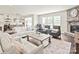 Inviting living room with cozy seating, stone fireplace, and natural light, perfect for relaxation and entertaining at 6320 Tilley Way, Matthews, NC 28105