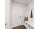 Welcoming mudroom offers a built in bench, storage, and access to the garage at 6320 Tilley Way, Matthews, NC 28105