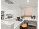 A dedicated office space featuring built-in desk, shelving, and stylish decor at 6320 Tilley Way, Matthews, NC 28105