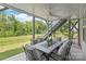 Covered patio with outdoor table, fan, and stairs to the backyard at 6320 Tilley Way, Matthews, NC 28105