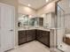 Modern bathroom with double vanity, a framed mirror, tile floors, and a glass-enclosed shower at 6388 Fairfax Ct, Maiden, NC 28650