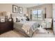 Cozy bedroom featuring neutral tones, a large window, and comfortable furnishings at 6388 Fairfax Ct, Maiden, NC 28650