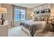 Warm bedroom features a comfortable bed, beautiful window and matching bedside tables at 6388 Fairfax Ct, Maiden, NC 28650