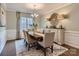 Elegant dining room featuring a wooden table with seating for six, complemented by a stylish chandelier and buffet at 6388 Fairfax Ct, Maiden, NC 28650