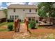 Spacious backyard with a wooden bridge and a covered patio area, great for outdoor entertaining at 6422 Gatesville Ln, Charlotte, NC 28270