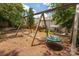 Backyard playground featuring swings and view of the home's backyard and patio at 6422 Gatesville Ln, Charlotte, NC 28270