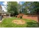 Backyard of a home showing grass and a deck in the back at 6422 Gatesville Ln, Charlotte, NC 28270