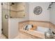 Relaxing bathroom with soaking tub, tiled shower and a glass enclosure adding elegance to the space at 6422 Gatesville Ln, Charlotte, NC 28270