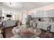 Well-lit kitchen with glass top table, view of the dining area, stainless steel appliances, and granite countertops at 6422 Gatesville Ln, Charlotte, NC 28270