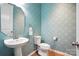 Charming powder room with designer wallpaper and pedestal sink at 809 Ayrshire Ave, Fort Mill, SC 29708