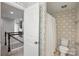 Upstairs bathroom features patterned wallpaper and a shower and tub combination at 809 Ayrshire Ave, Fort Mill, SC 29708