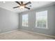 Bright bedroom with neutral walls, carpet, and a ceiling fan for optimal comfort at 809 Ayrshire Ave, Fort Mill, SC 29708