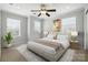 A stylish bedroom with a neutral color scheme, area rug and windows with natural light at 809 Ayrshire Ave, Fort Mill, SC 29708
