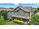 Charming multi-story townhome with stone and siding, covered porch, and manicured landscaping at 809 Ayrshire Ave, Fort Mill, SC 29708