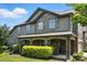 Charming two-story home featuring mixed siding, covered entryway with arched columns, and well-maintained lawn at 809 Ayrshire Ave, Fort Mill, SC 29708